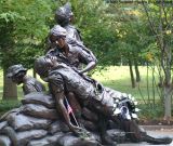 The Vietnam Womens Memorial statue at the Vietnam Veterans Memorial Wall stock photo #LS02_1681