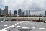 A partial view of the helo deck onboard the USCGC BERTHOLF (WMSL 750) with downtown Miami in the background, photo #0535