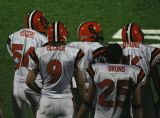 defense watches from the sideline
