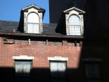 Window Reflection - Rising Sun on Two Gables