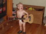 Conner playing the guitar