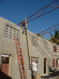 putting the boards up on the trusses (these is what the tin is nailed into)