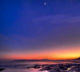 Moon rising over Douglas bay