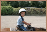 Josh riding a pony at Delaneys 3rd birthday