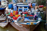 Weighing, recording, off-loading the fish at the market (and also a chance to check your text messages)