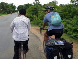 Cambodians would often ride up and chat with us as we rode along.  Usually asking us our names and where we were from