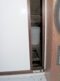 Starboard side of sliding door, open, with latch at lower right side.