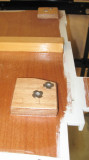 Tee nuts on backing under aft floorboard for securing engine box hinges.