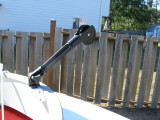 Or, a pulley to ease hauling anchor line or crab pot line over the side.