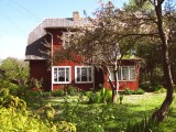 A Red Villa with Garden..
