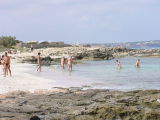 Bathers enjoy the warm sea