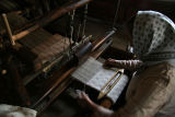 working at hand loom