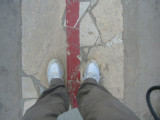 One foot on each side