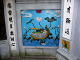 The other mural is a depiction of the Golden Turtle God with the magic sword based on the legend of Hoan Kiem Lake.
