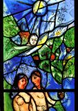 Chagall stained glass window in St. Stephens of Adam and Eve in the Garden of Eden.