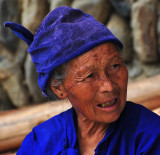 Xijiang Miao woman on top of the mountain