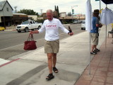 Jack Dennis with his wife Meg's purse, tries to walk a line.