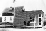Research amongst former Charleswood residents of the 1940 era concludes these two buildings were located on the corner of Elmhurst Rd and Roblin Blvd. The brick building in the foreground was a grocery store/Post Office and operated by Tommy Chester then later by the Bloomer family. Later it was named The Willows and served as a short order restaurant ie hamburgers, pizza, etc.
The house behind the store was also owned by Tommy Chester who rented it to Bill McKennitt's mother and the family (Marnee, Bill & Sharon) lived there for a number of years.
If you're interested or ever lived in the area, send me an email and I'll provide some further history.