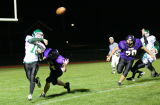 Evan Tripicco throwing while evading the pass rush