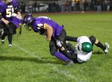 Chris Furner tackles the running back for a loss