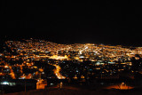View of the brightly lit hills of Cusco at night