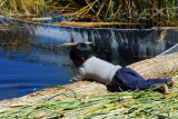 Uros boy playing alongside the fish pen