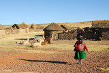 Each family lives in a walled enclosure with several huts