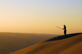 Martial arts practice on the dunes at sunset, Huacachina