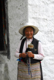 Tibetan pilgrim with a prayer wheel