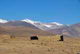 Ruins in front of snow capped mountains