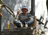 Friendly boy posing up on a perch, old town Tsetang