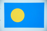 The flag of the Republic of Palau, independent since 1994 with pop. 20,600 located 1300 km SSW of Guam and 1600 km SE of Manila