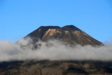 Summit of Mt Doom rising above the clouds