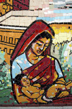 Bangladeshi woman cradling a baby on the Bangla Academy mosaic