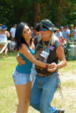 Redneck Games Mascot Freight Train Dancing with Young Lady in Crowd.