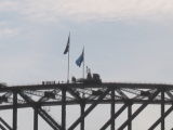 If you look close you can see the bridge climbers just to the left of the flag pole
