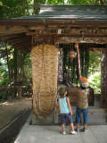 Kids at a small shrine on the farm site