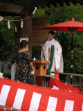 Shrine attendant offering a blessing