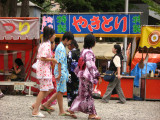 Yukata-clad girls and yakitori stall