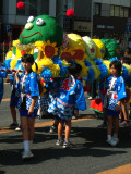 Children carrying a caterpillar palanquin