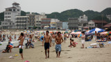 Young guys strolling the sand