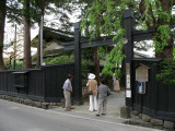 Tourists peeking inside a buke-yashiki courtyard