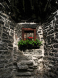 Flower-adorned window in an alcove