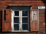 Window and shutters on an old wooden house