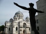 Man statue and St. Michael the Archangels Church