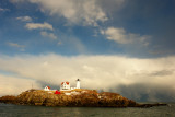100DSC03437.jpg 'SNOW SQUALL AND DISTANT WATER SPOUT AT NUBBLE LIGHTHOUSE... lighter than adj one