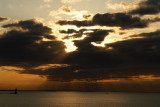 DSC05206.jpg   HERE COMES THE SUN just for a moment only... Ram lighthouse behind portland head light