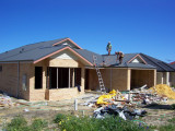 Roof Cladding going on.