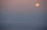 Full moon and container ship