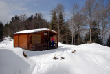 SD in the snow with cabin